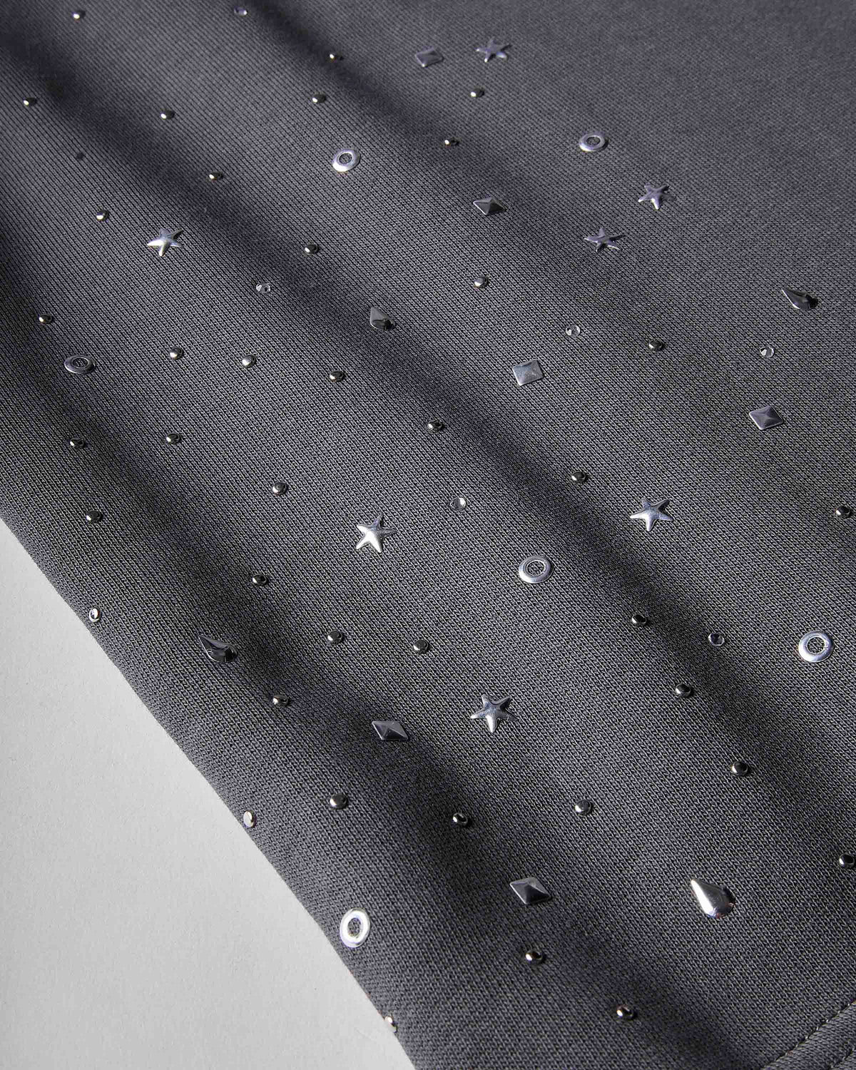 Displays the silver 'hoodrich' branded Clash V2 Oversized Wide Leg Joggers featuring the close up on the details