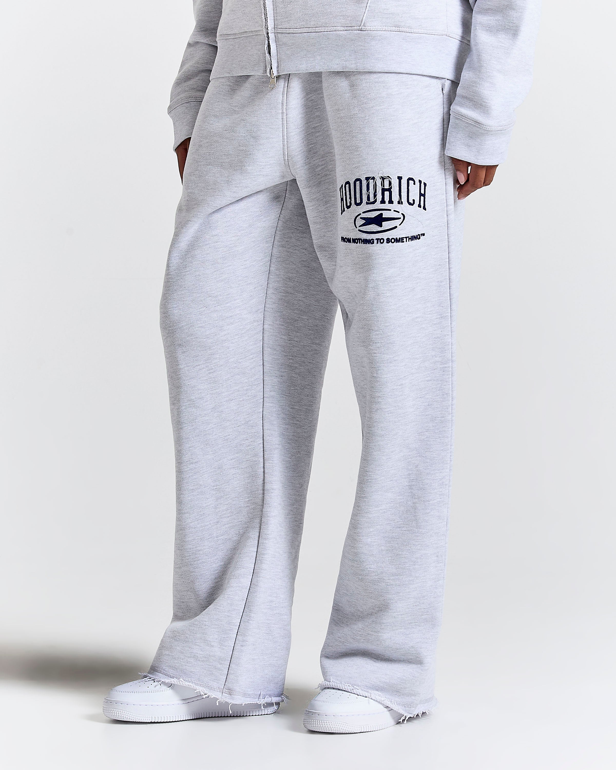 Displays a model wearing the Grey 'Hoodrich' branded Women's Frey Full Tracksuit