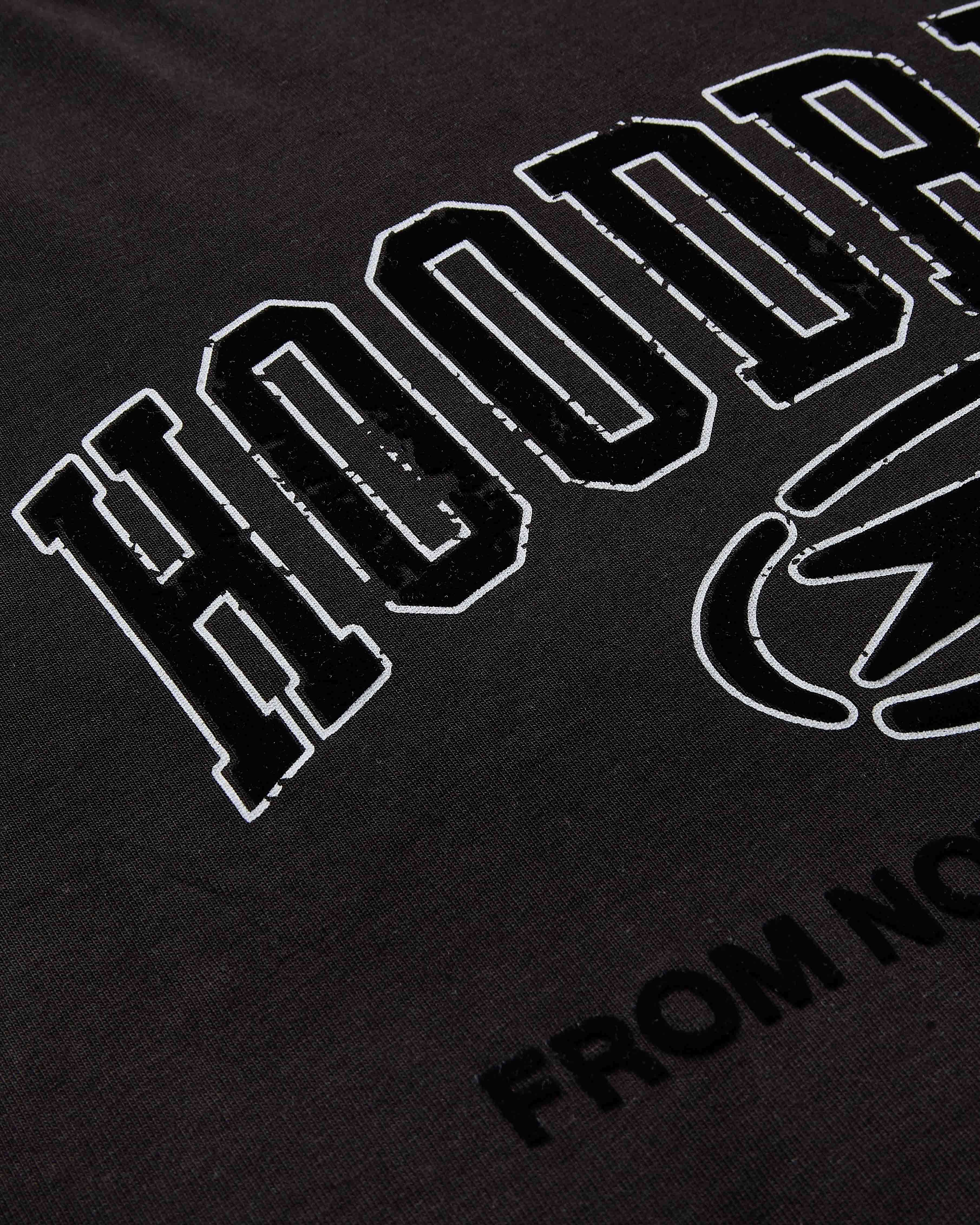 Black t-shirt with white text and logo on a dark background