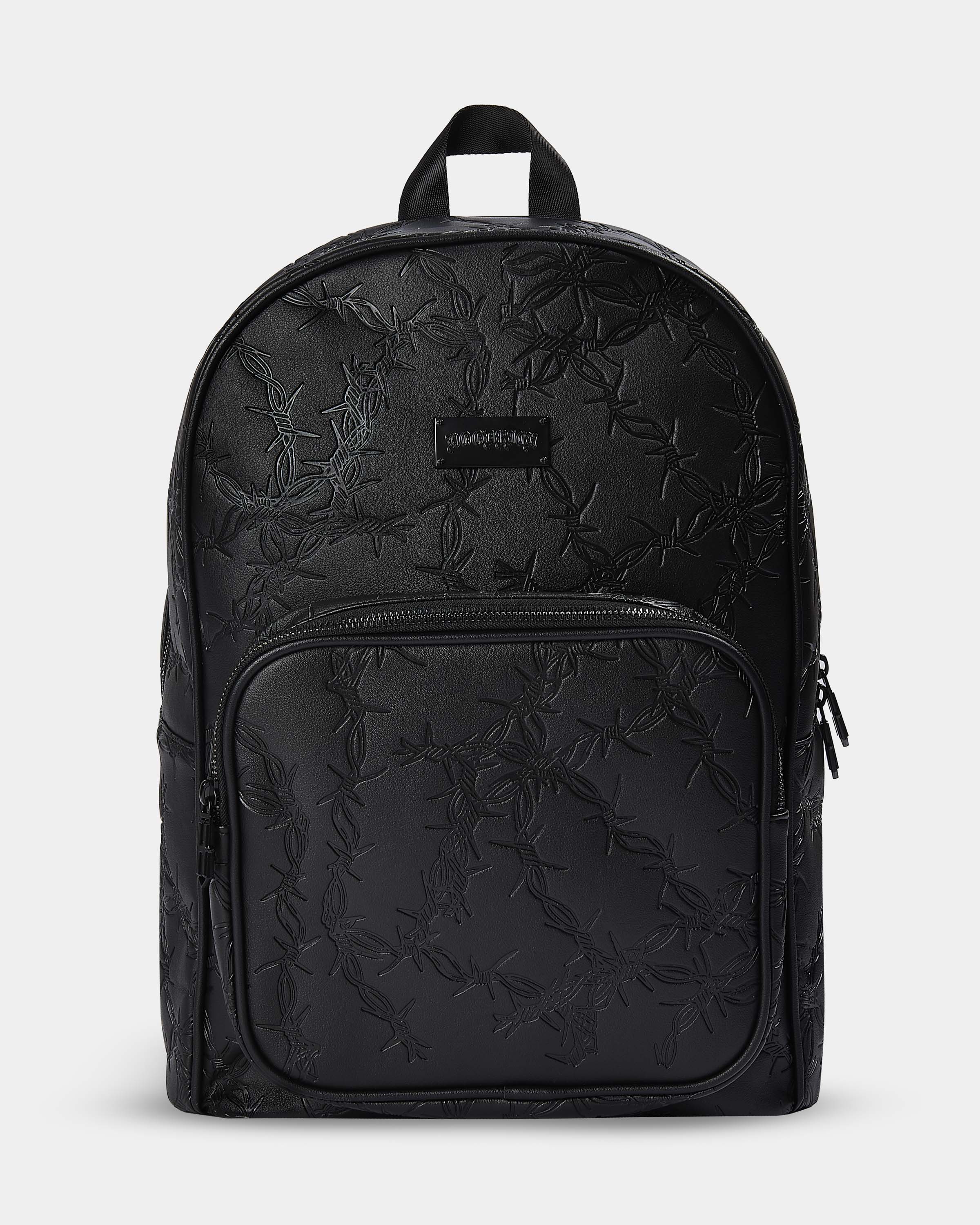 Black backpack with subtle pattern on a light gray background