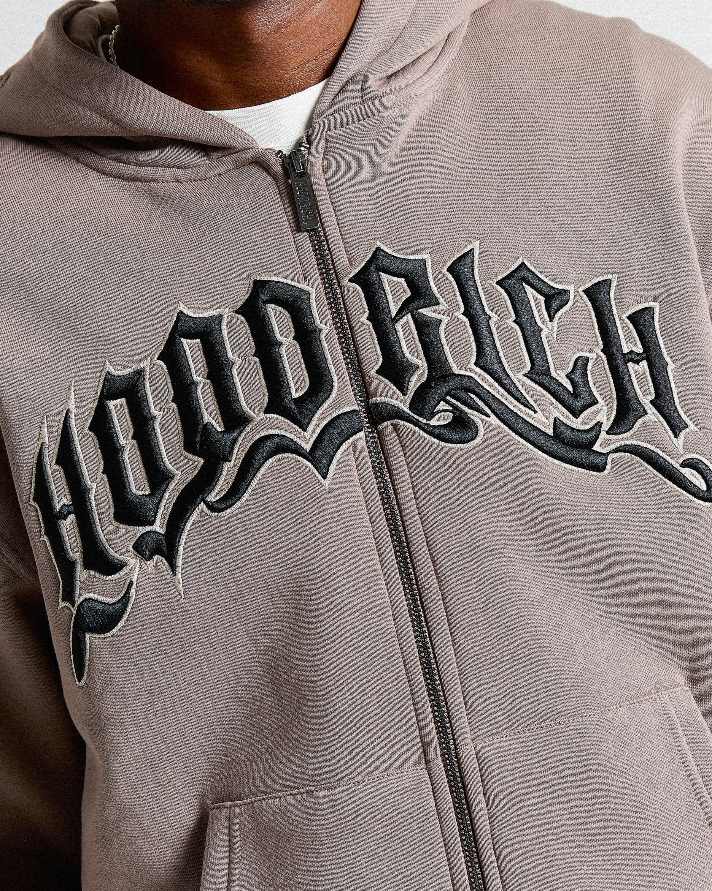 Gray hoodie with 'Hood Rich' text on a white background