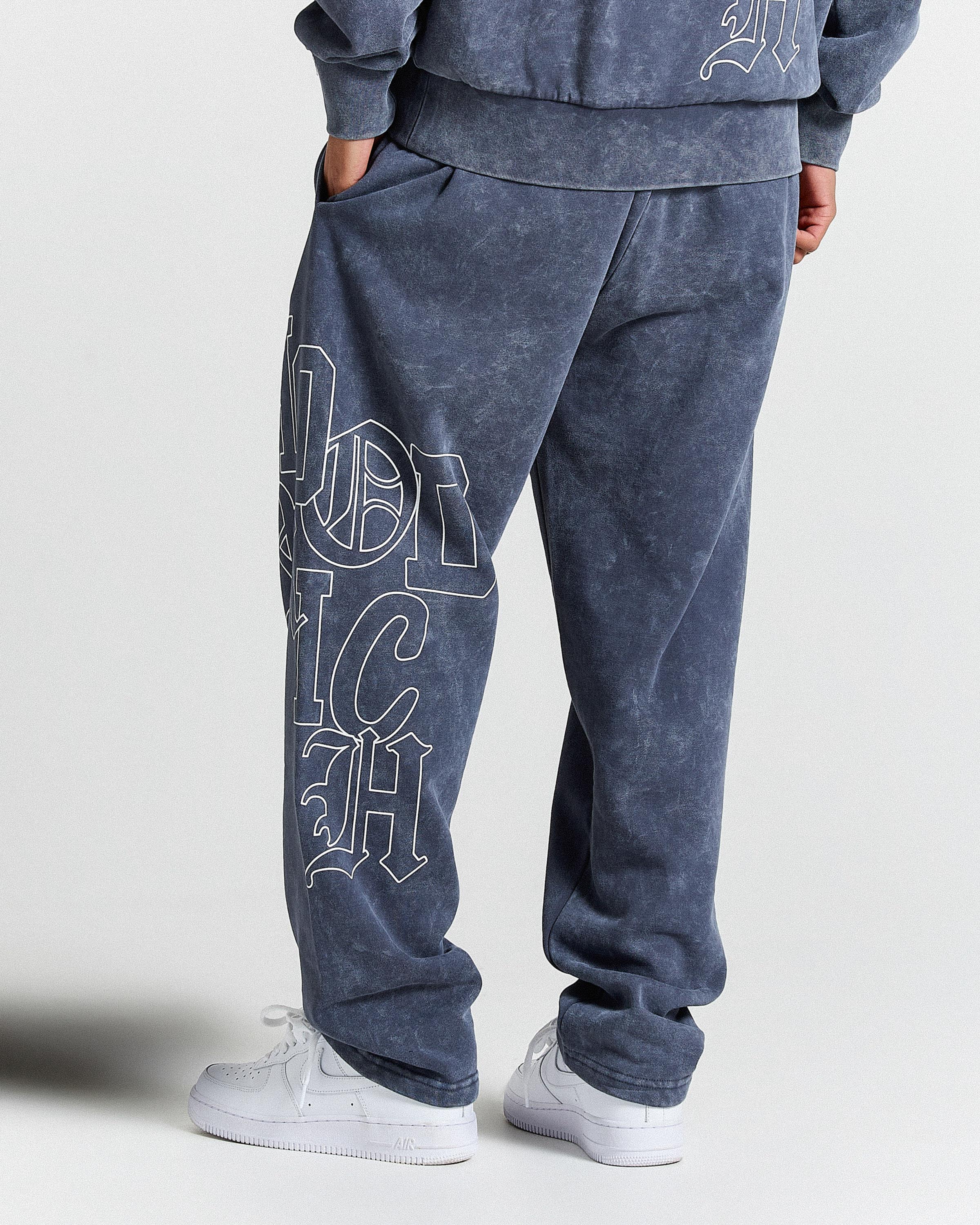 Displays a model wearing the Blue & white 'Hoodrich' branded Heritage Full Tracksuit