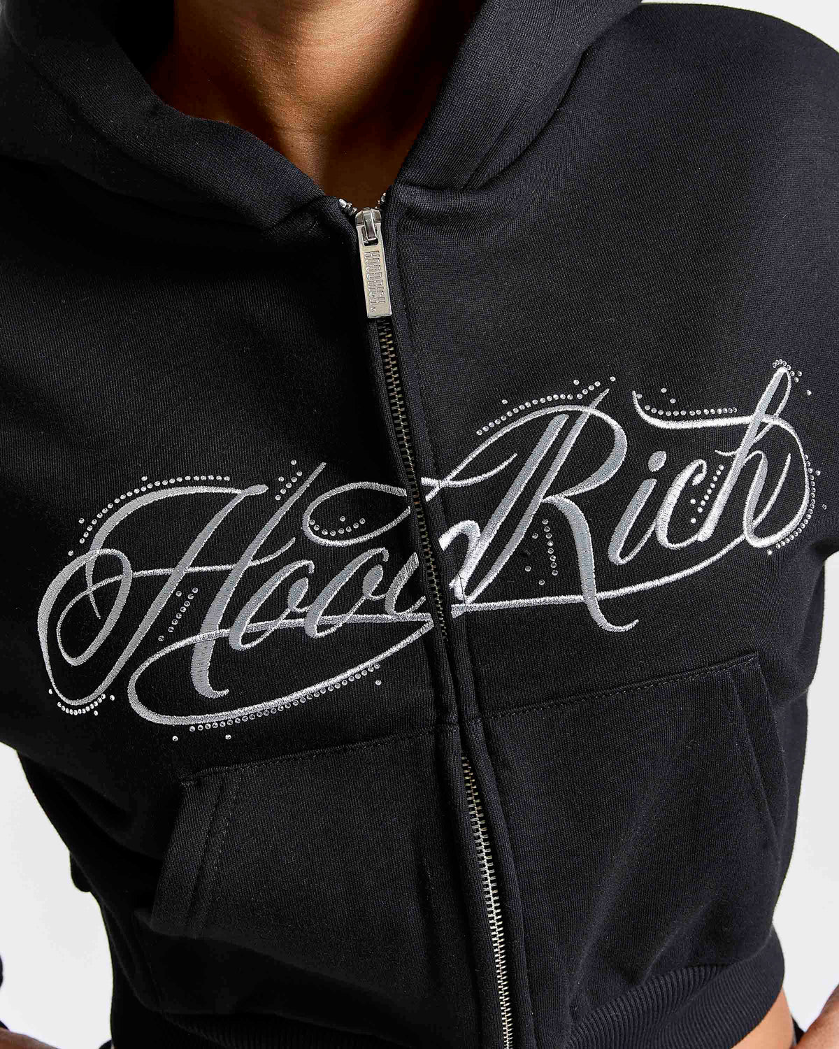 Displays a model wearing the Black 'Hoodrich' branded women's Solace Full Tracksuit featuring the hoodrich branding 
