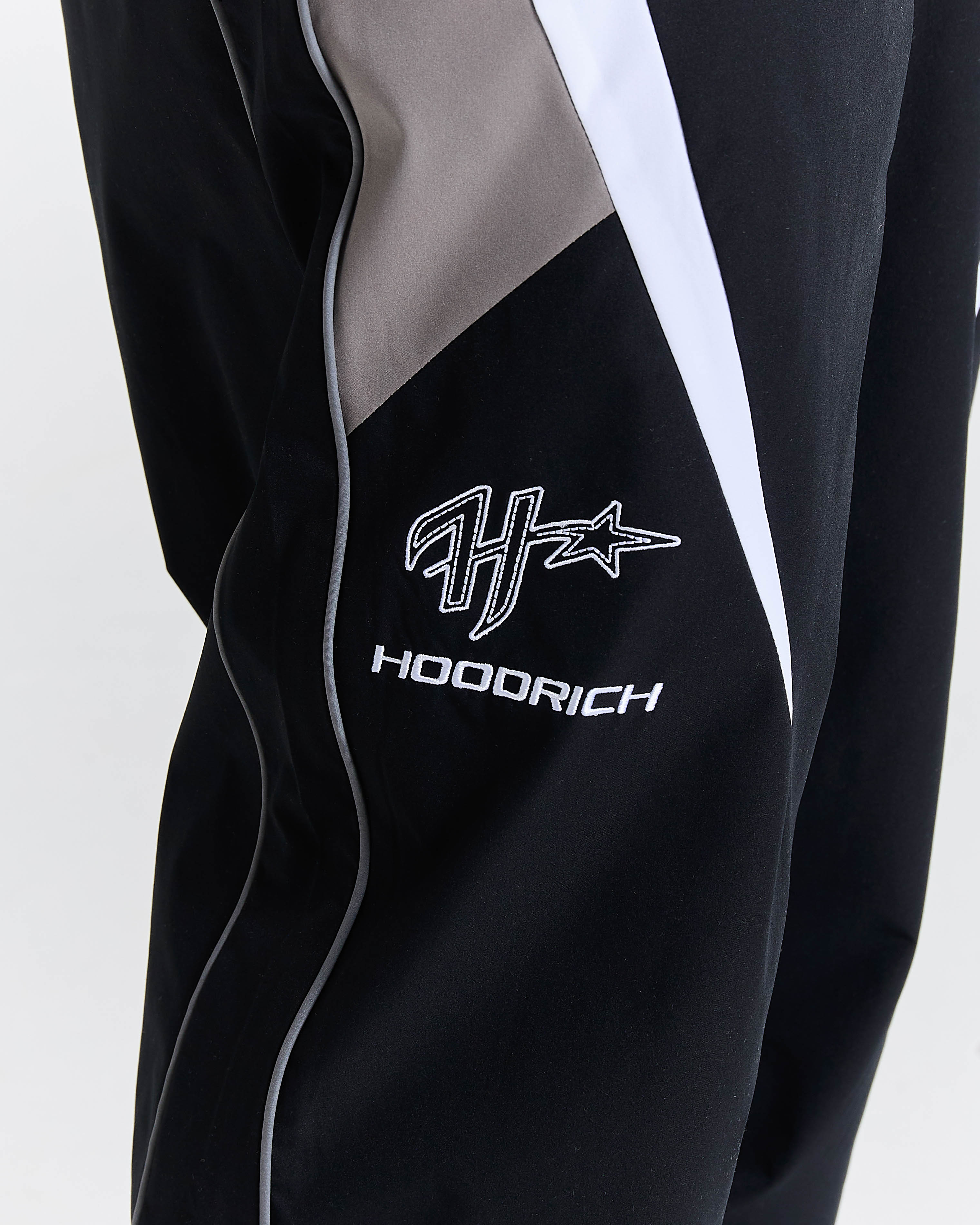 Black jacket with 'Hoodrich' logo on a white background