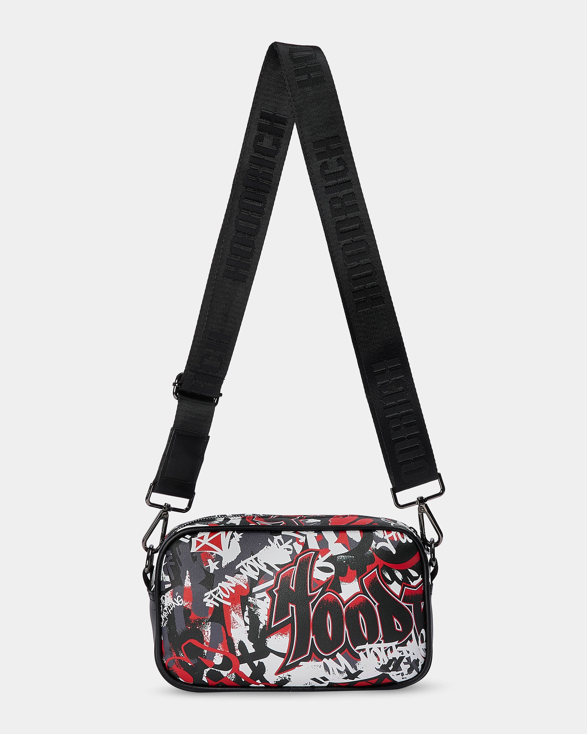 Crossbody bag with black strap and red and white graphic design on a light gray background