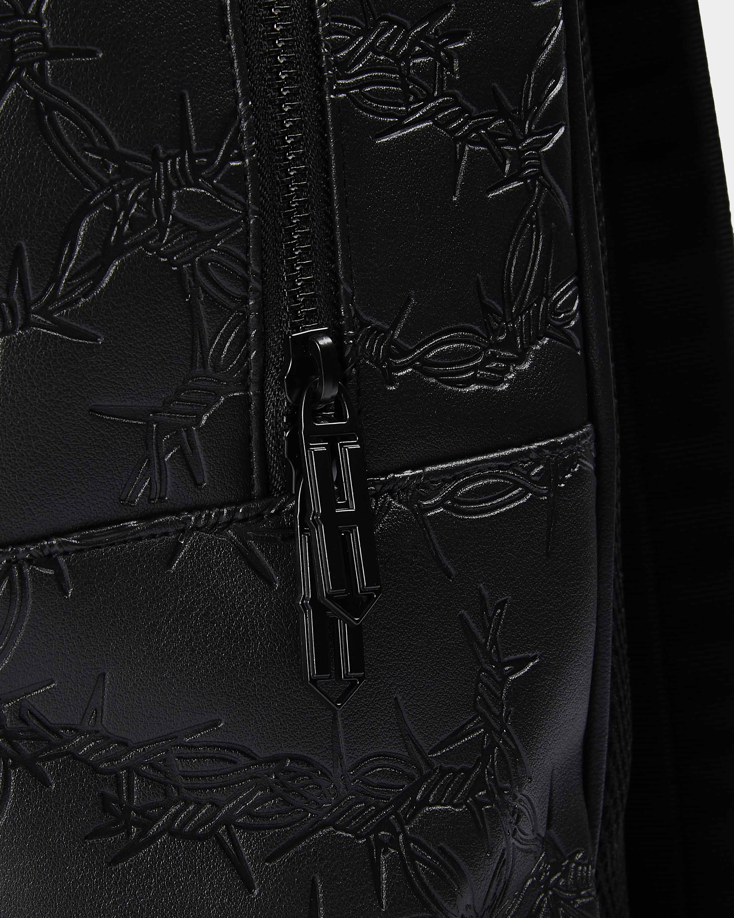 Black textured bag with barbed wire design and a zipper, featuring a brand logo.