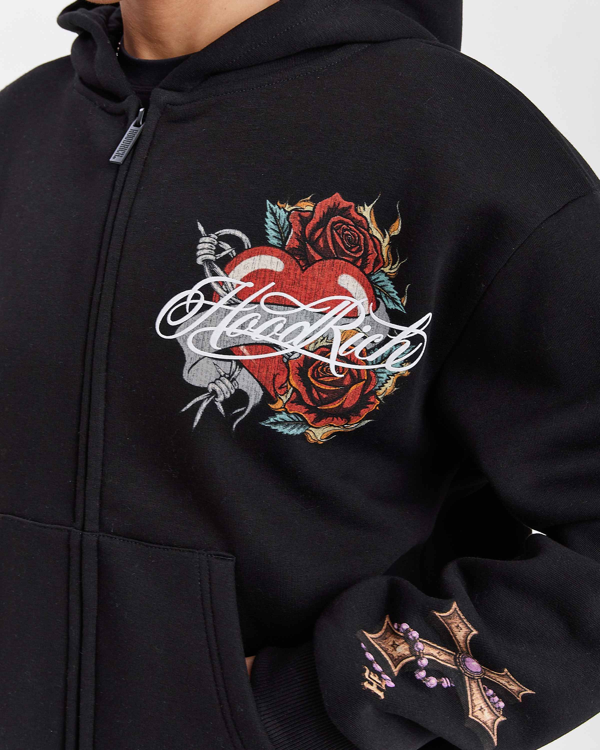 Black hoodie with a heart and roses design on a white background