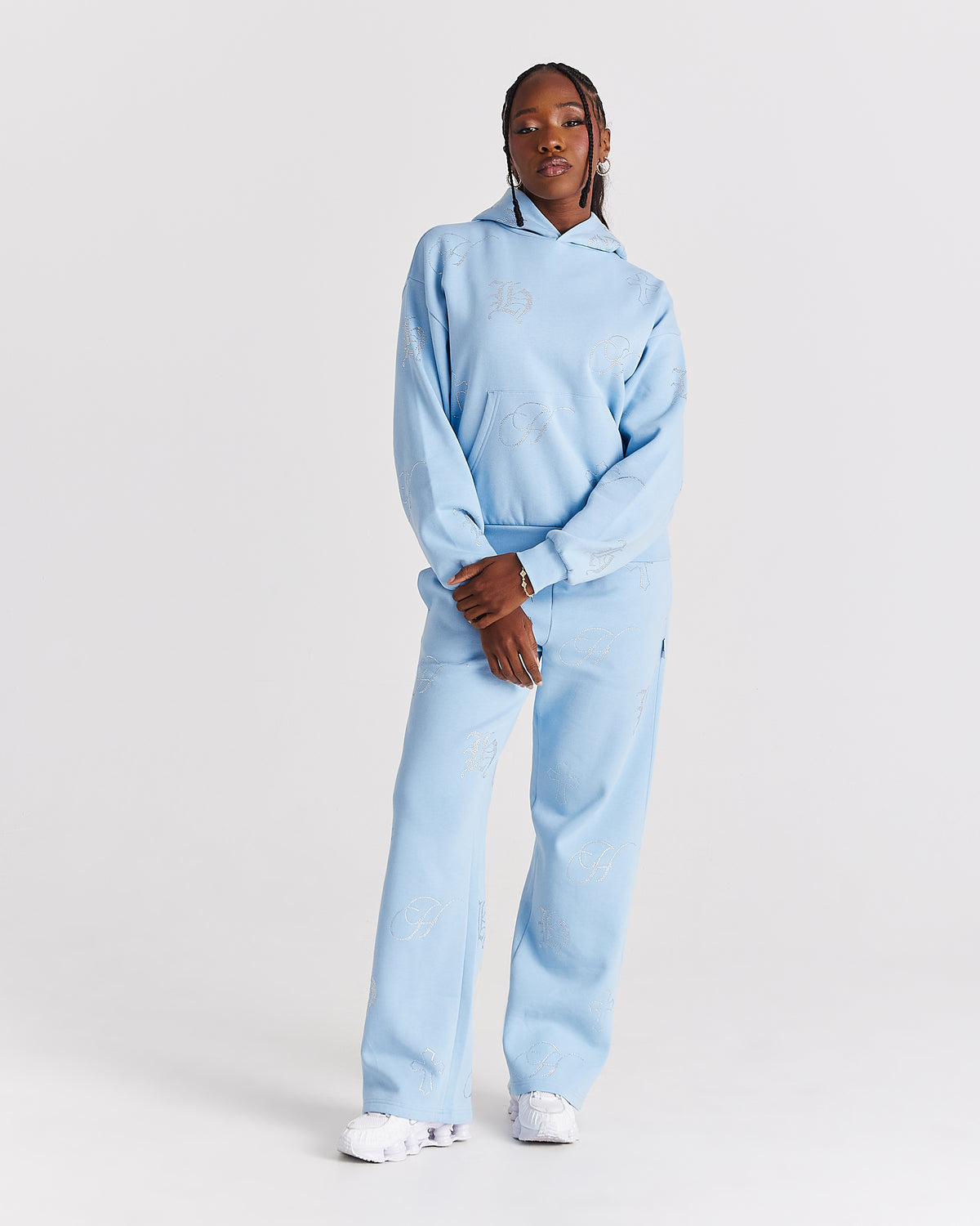 Displays a model wearing the blue 'Hoodrich' branded women's Crystal Full Tracksuit