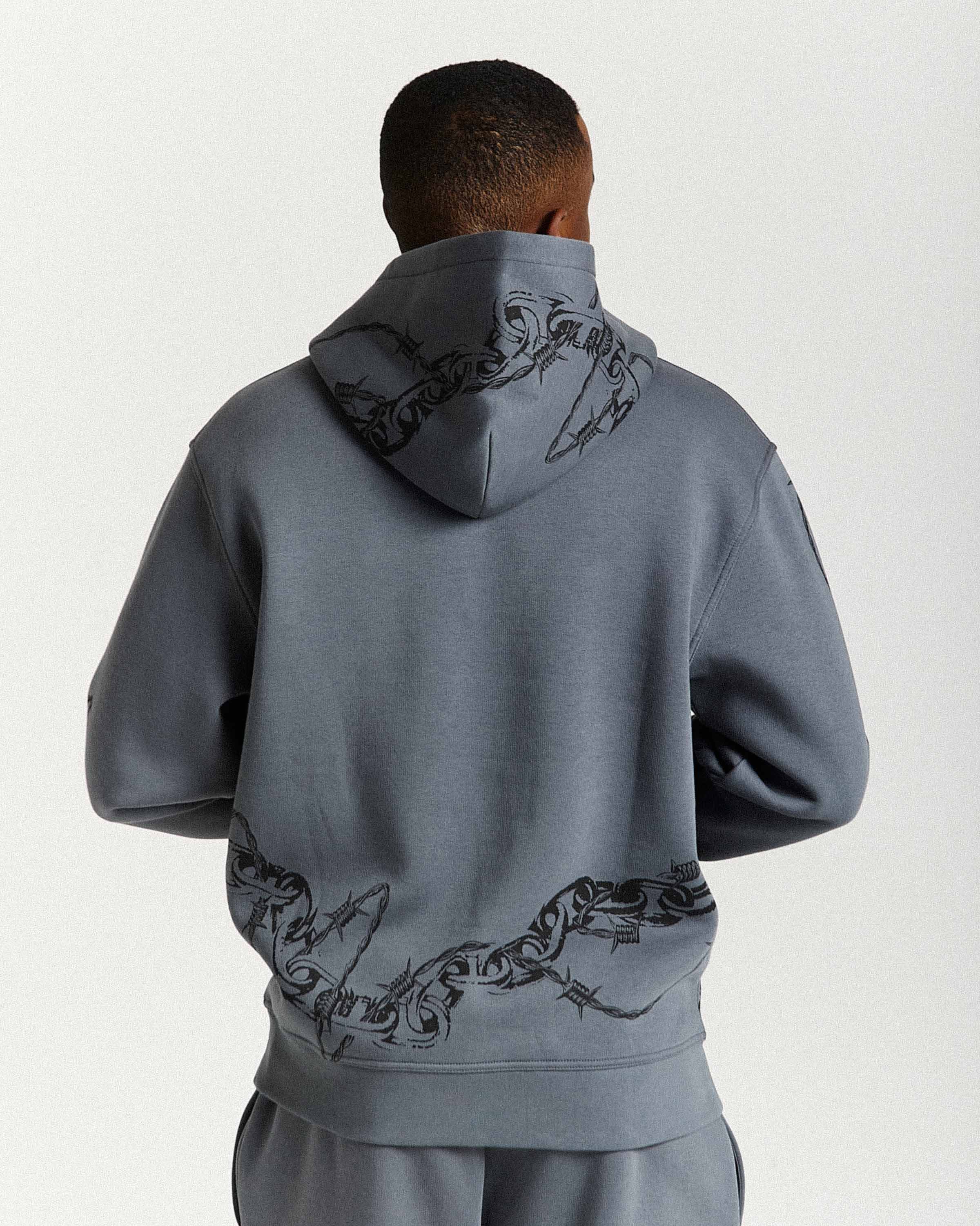 Displays a model wearing the Grey men's Guepard Full Tracksuit